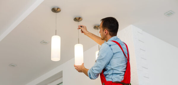 Electrician changing lights