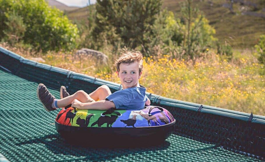 Child on tubing slide