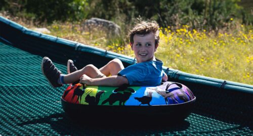 Child on Tubing Slide