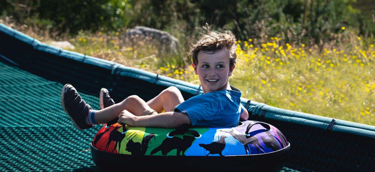 Child on Tubing Slide