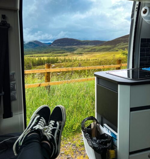 Person relaxing in campervan