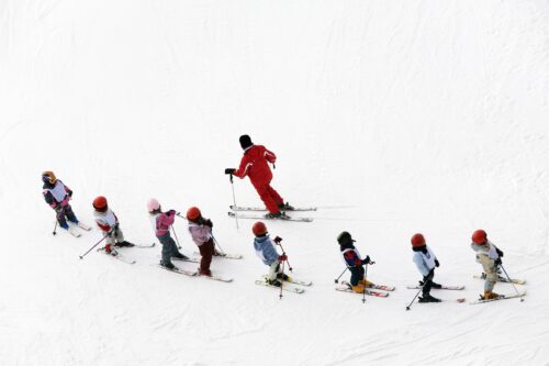 Children learning to ski