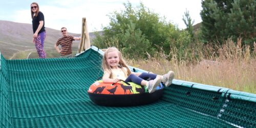 Young girl on tubing slide