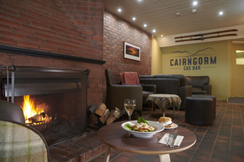 Cafe with lunch at fireplace