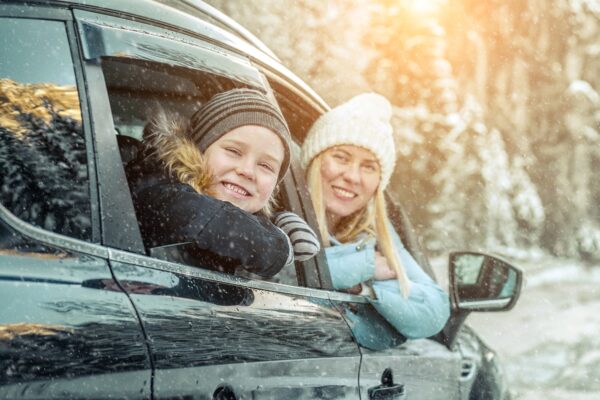 Family in car with snow