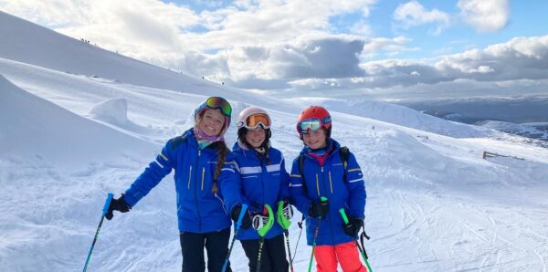 Three girls skiing