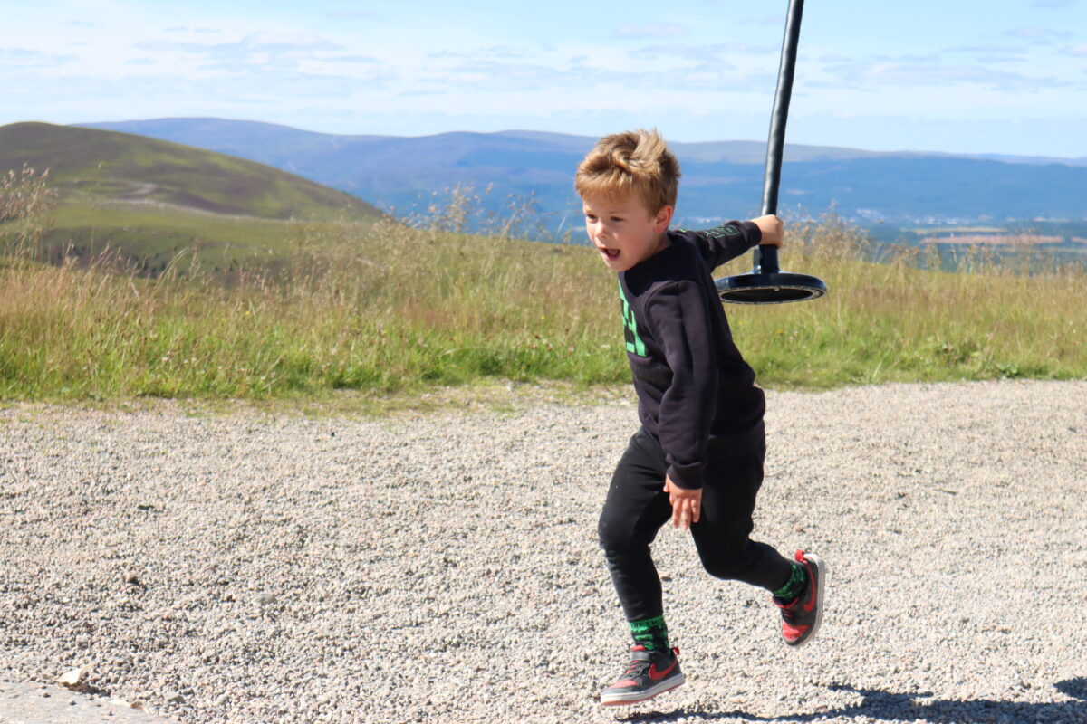 Boy at zip line at Cairngorm Mountain