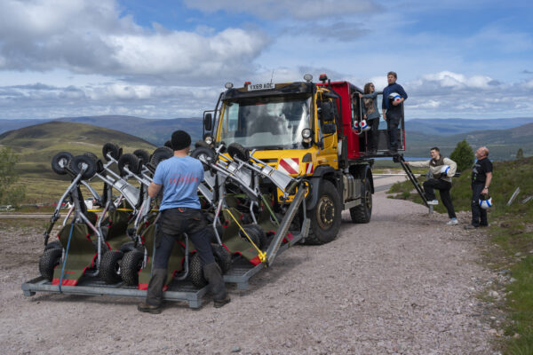 people getting in an offroad vehicle