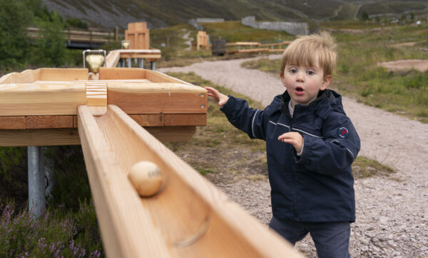 Young boy at ball runs