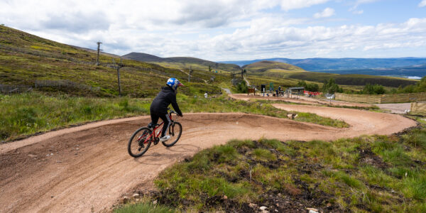 Person mountain biking in the Cairngorms