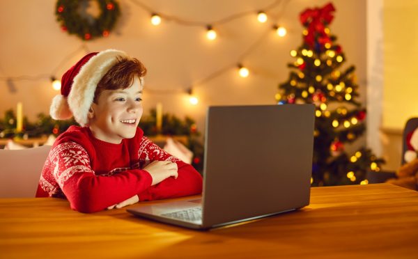 Child at Christmas with laptop