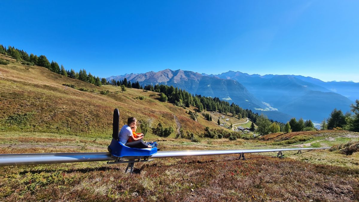 Children riding mountain toboggan