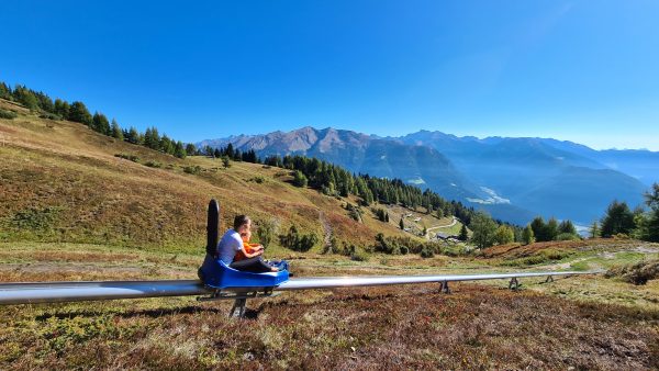 Children riding mountain toboggan