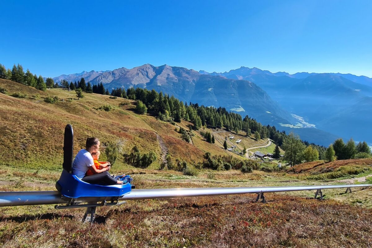 Children riding mountain toboggan
