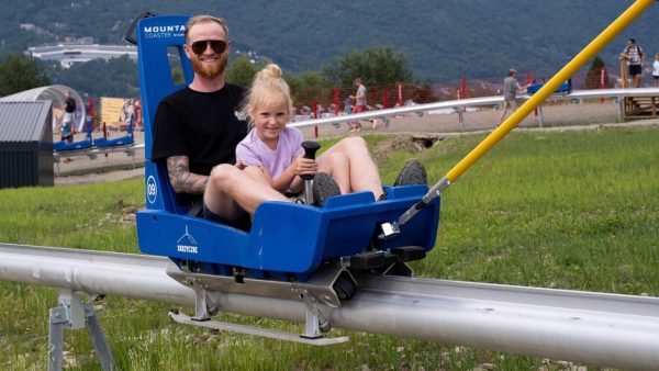 Adult and child on toboggan